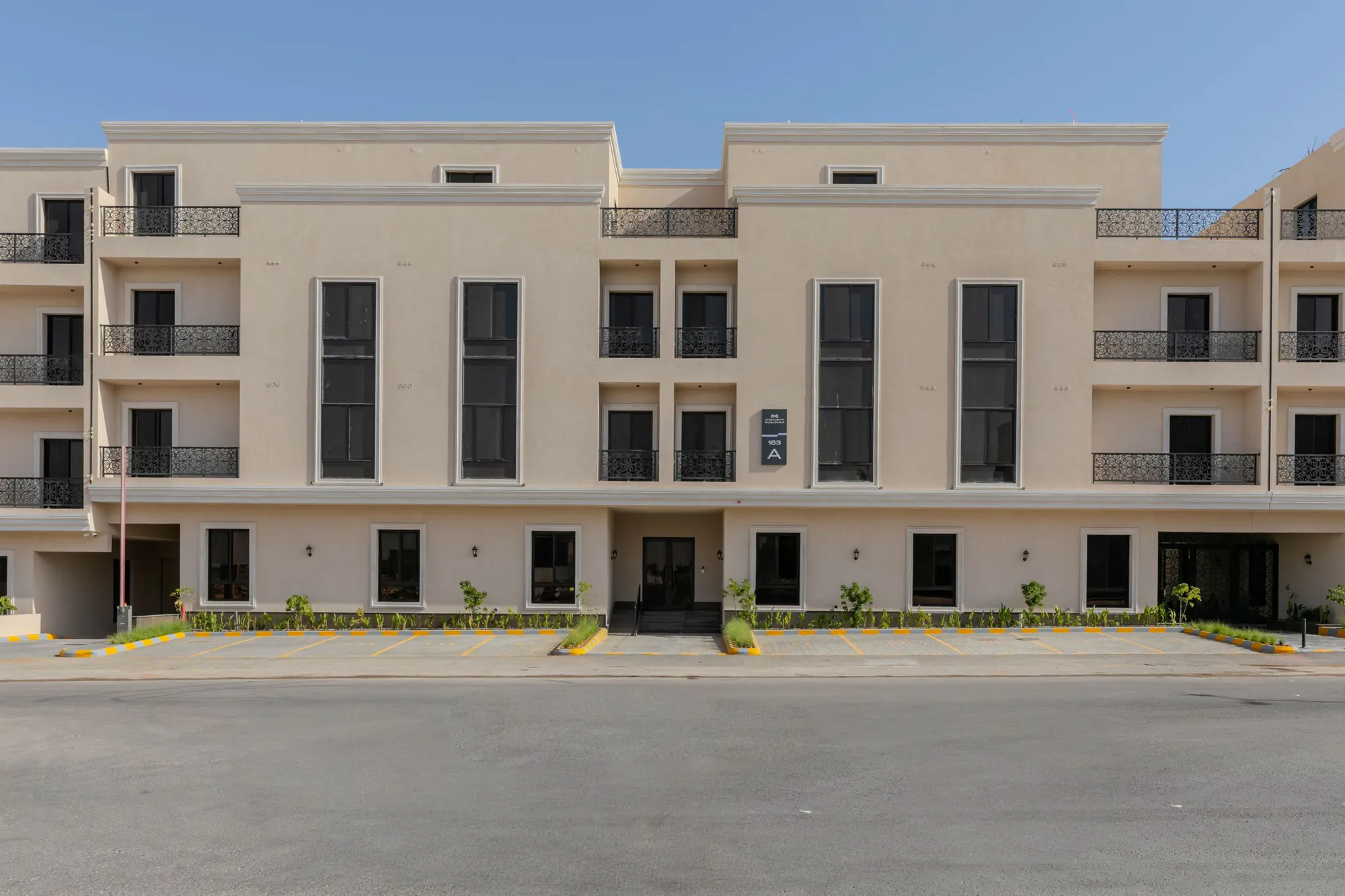 Photograph of a front elevation at Al Majdiah 163 with balconies