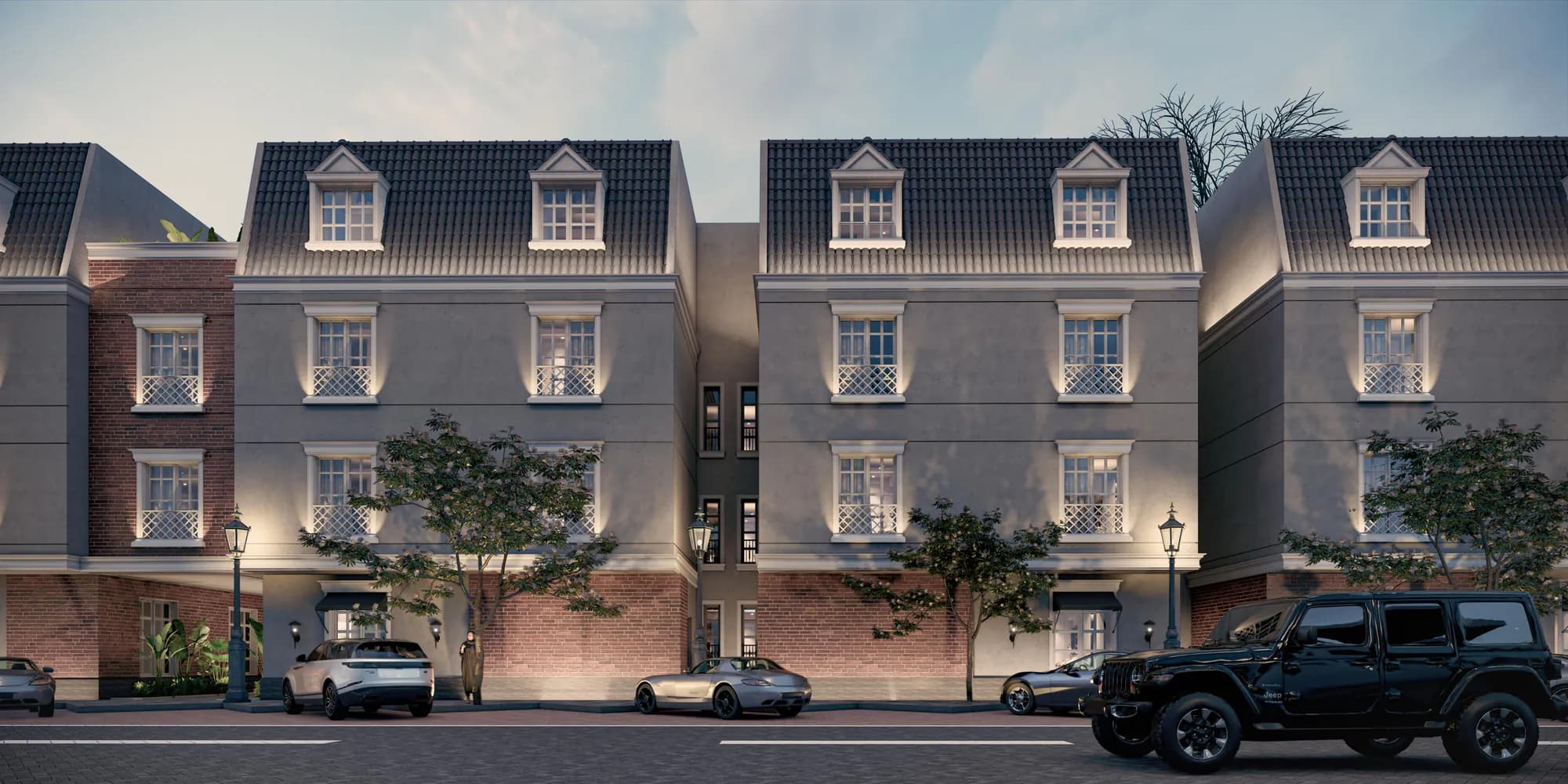 Developer render of Al Majdiah 192 at dusk, with warm light in the windows and street lamps along the frontage