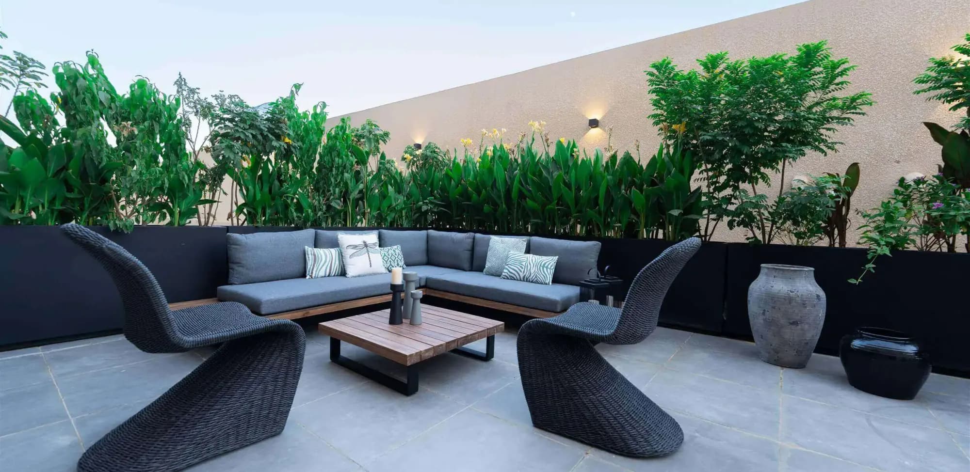 Photograph of Asala Residence - Al Nahdah 1 in Riyadh: outdoor seating beside planted spaces