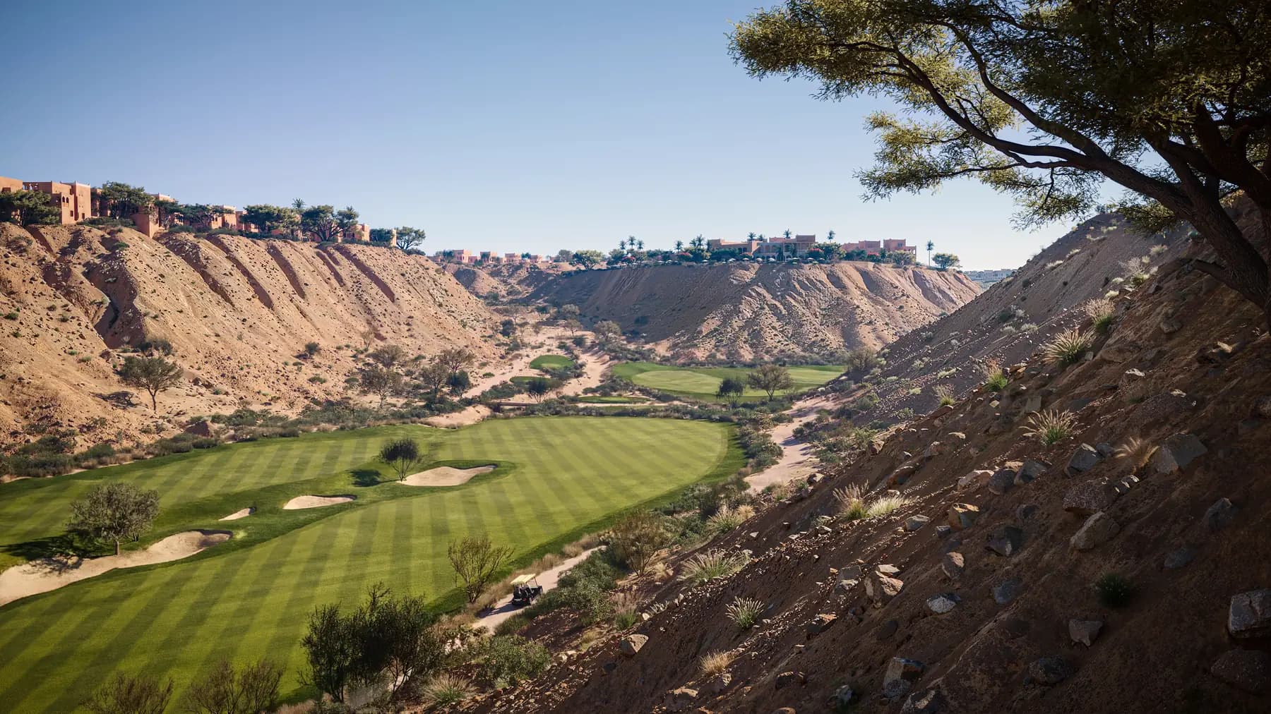 The championship golf course carved into the Wadi Safar escarpment