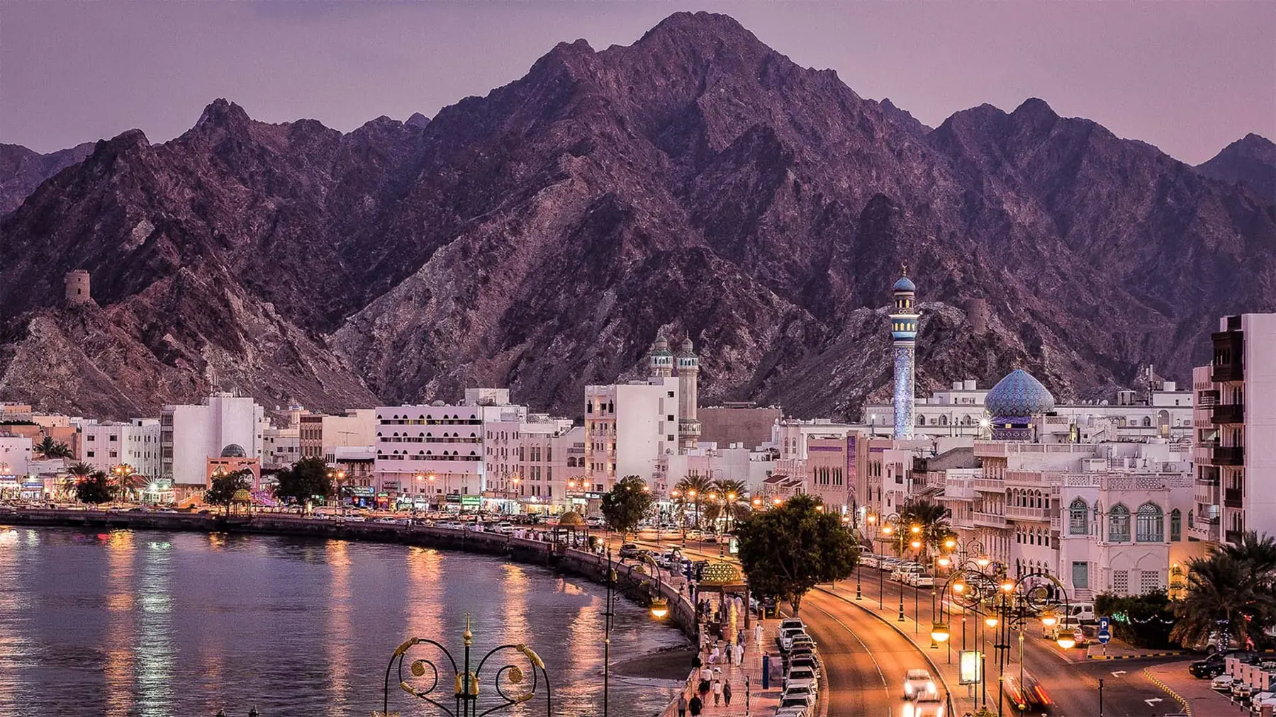 Muscat waterfront and mountains at dusk, Oman