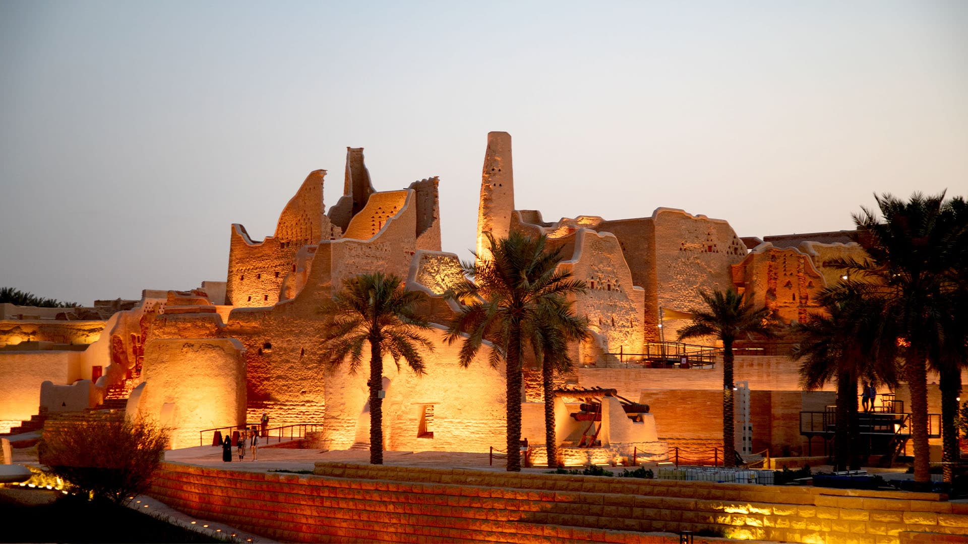 Riyadh at dusk, the financial-district towers rising from the Najd plateau