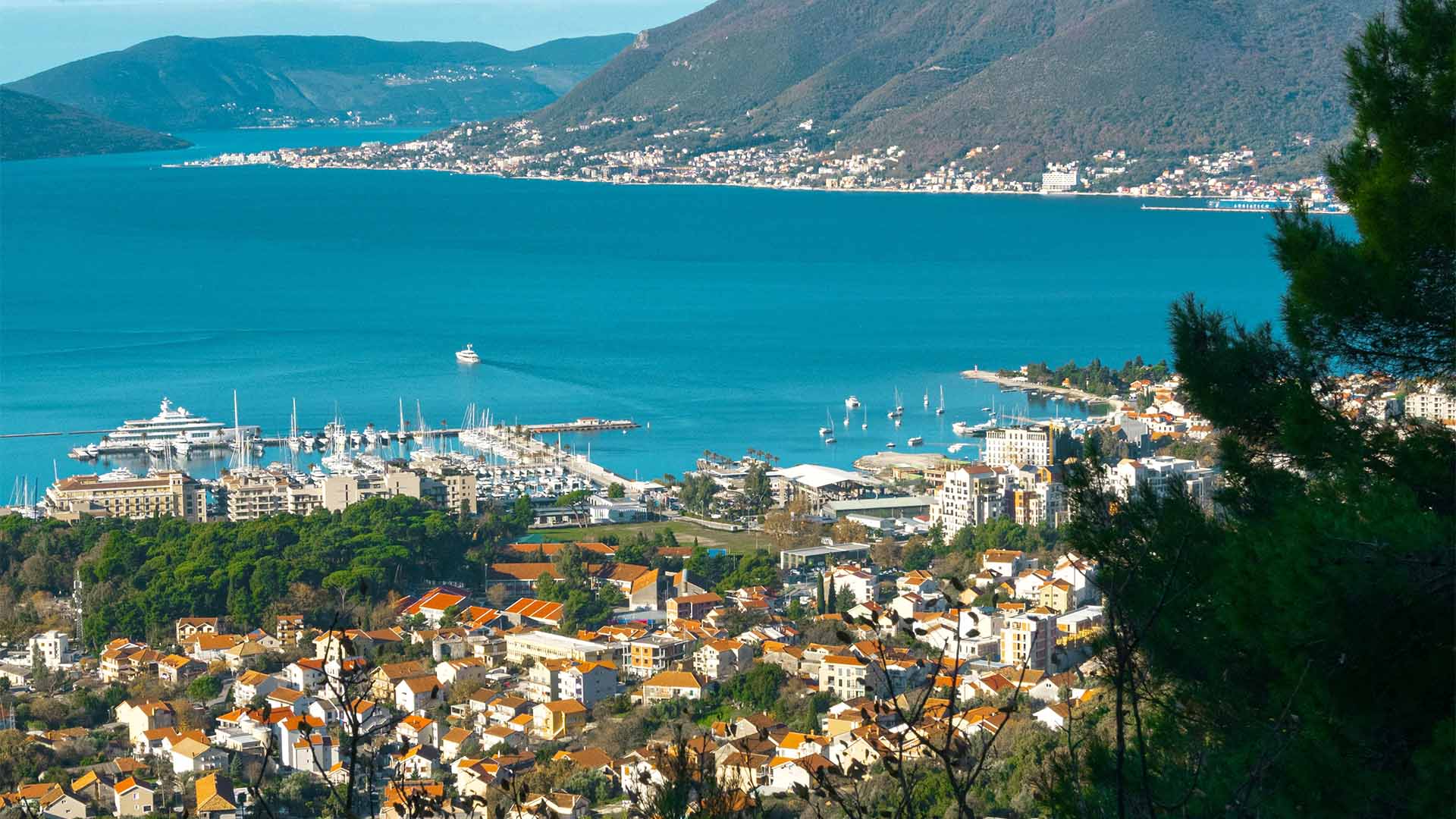Porto Montenegro marina at Tivat on the Bay of Kotor, superyachts berthed below the Adriatic hills